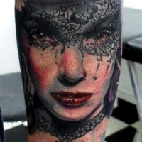 Portrait style colored tattoo of woman with mask and flowers