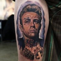 Portrait style colored thigh tattoo of woman with face and flowers