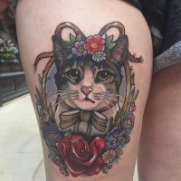 Portrait style colored thigh tattoo of cat with bow and flowers