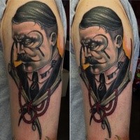 Portrait style colorful shoulder tattoo of mystic man