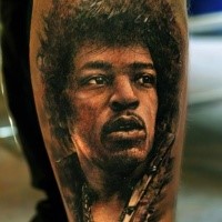 Portrait style detailed leg tattoo of mans face