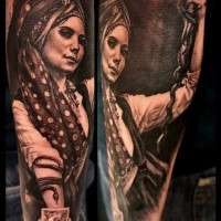 Portrait style very detailed arm tattoo of gypsy woman with snake
