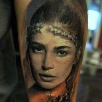 Portrait style very detailed arm tattoo of beautiful ancient woman with warriors