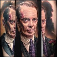 Portrait style very detailed tattoo of cool famous actor in suit and with flower
