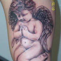 Praying baby cherub tattoo