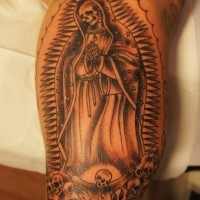 Praying death tattoo on leg