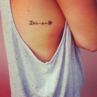 Pretty small arrow tattoo on girls body