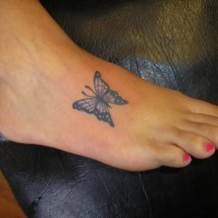 Pretty small butterfly tattoo on foot design