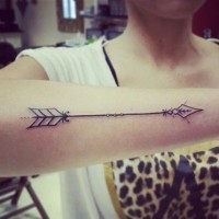 Pretty stylized indian arrow tattoo for girls