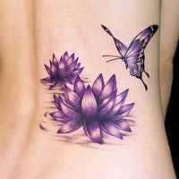 Purple flowers and butterfly tattoo on ribs