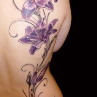 Purple morning glory flower on back tattoo