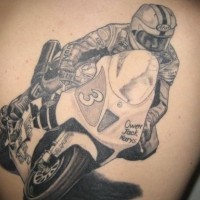 Racer in sports bike tattoo