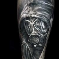 Real lifelike realism style black and white forearm tattoo of man in gas mask