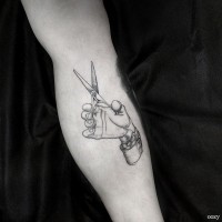 Real like hand with hairdressers scissors black and white tattoo on forearm area in old style