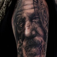 Real photo like amazing detailed black and white old wizard tattoo on shoulder