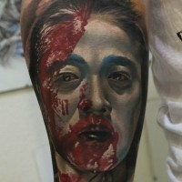 Real photo like big colored forearm tattoo of bloody geisha portrait