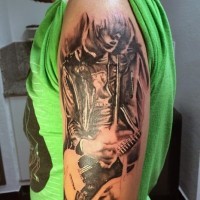 Real photo like black and white playing musician tattoo on arm