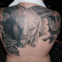 Real photo like black and white very detailed upper back tattoo of devil portrait