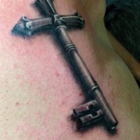 Real photo like black ink cross shaped gorgeous key tattoo on arm