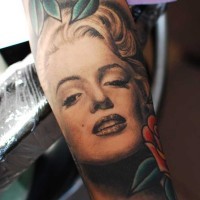 Real photo like very detailed black ink on forearm tattoo of Merlin Monroe portrait