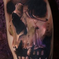 Real photo style colored and detailed biceps tattoo of human skull
