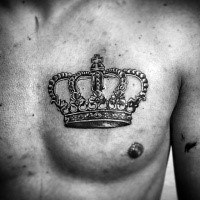 Realism style beautiful looking crown tattoo on chest