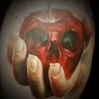 Realism style beautiful looking woman hand with skull shaped apple tattoo