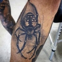 Realism style big black ink spider tattoo on leg
