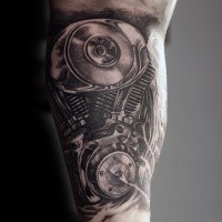Realism style black and white biceps tattoo of car engine