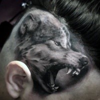 Realism style black and white head tattoo of roaring wolf head