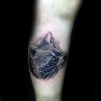 Realism style black and white leg tattoo of raccoon head