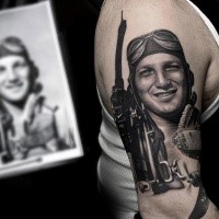 Realism style black and white shoulder tattoo of WW2 pilot with plane