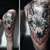Realism style black and white thigh tattoo of wolf with cool ornaments