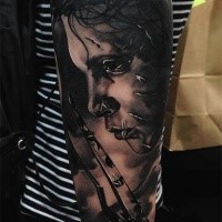 Realism style black ink arm tattoo of Edward Scissors-hands