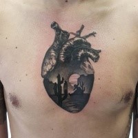 Realism style black ink chest tattoo of human heart and desert