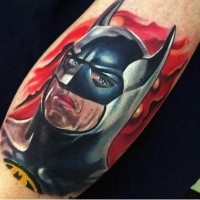 Realism style colored arm tattoo of Batman face