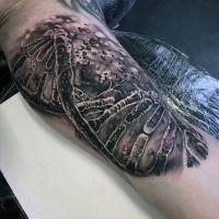 Realism style colored arm tattoo of broken DNA