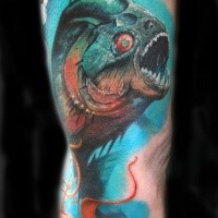 Realism style colored arm tattoo of creepy fish
