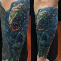 Realism style colored arm tattoo of creepy looking fish