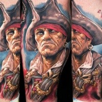 Realism style colored arm tattoo of demonic pirate