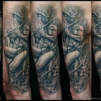 Realism style colored arm tattoo of devils stone statue