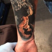 Realism style colored arm tattoo of hand with burning match