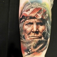 Realism style colored arm tattoo of old Indian