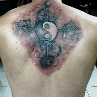 Realism style colored back tattoo of cross with Yin Yang symbol