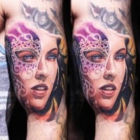 Realism style colored biceps tattoo of cute woman with mask