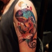 Realism style colored big chameleon tattoo on shoulder combined with flower and colored circles