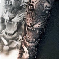 Realism style colored forearm tattoo of roaring tiger