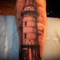 Realism style colored forearm tattoo of large lighthouse