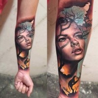 Realism style colored forearm tattoo of woman portrait combined with wild lion