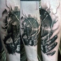 Realism style colored forearm tattoo of bulb with human hands